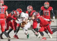  ?? Chris Kaufman/ Appeal ?? East Nicolaus High’s defense tackles a St. Bernard’s player during a playoff game in 2019 at River Valley High School in Yuba City.