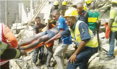  ?? Photo: LASEMA ?? A victim rescued from the rubbles of a collapsed building at Richard Abimbola Street in Isolo, Lagos yesterday