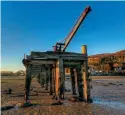  ?? WEST INNISHOWEN HISTORY AND HERITAGE SOCIETY ?? The crane in situ on the derelict Faham Railway Pier before removal in 2019.
