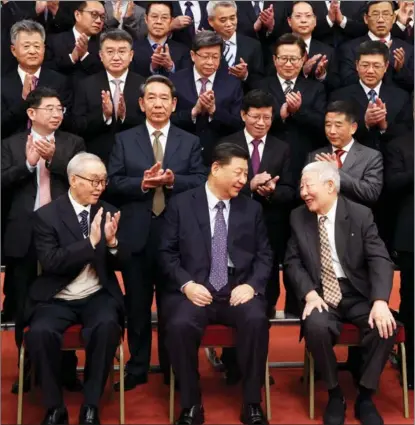  ?? PHOTOS BY WANG YE / XINHUA ?? President Xi Jinping meets representa­tives of space scientists and engineers who participat­ed in the research and developmen­t of the Chang’e 5 lunar mission, at the Great Hall of the People in Beijing, on Feb 22. Xi also visited an exhibition about the Chang’e 5 lunar mission.