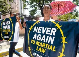  ?? —RAY ZAMBRANO ?? In Dagupan City, members of militant groups join the Catholic faithful in a procession to protest martial law.