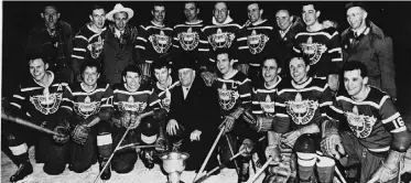  ??  ?? Team captain Bill Dawe, with the letter C, with Waterloo Mercurys’ 1952 Olympic gold-medal team.