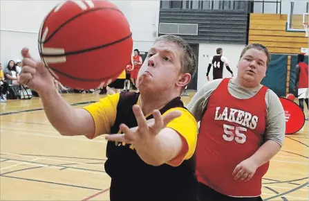  ?? CLIFFORD SKARSTEDT EXAMINER ?? St. Peter’s Justin Monk grabs a rebound during the 2018 Special Olympics Ontario School Championsh­ips on Wednesday at Trent University.