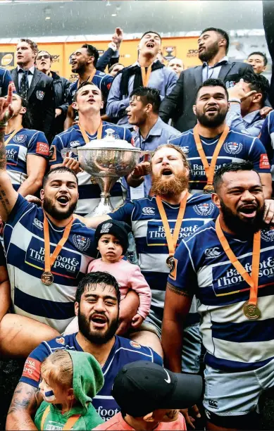  ??  ?? LONG TIME COMING The Auckland players celebrated their title when it came.