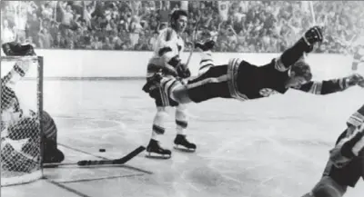  ?? RAY LUSSIER, ASSOCIATED PRESS ?? Boston Bruins’ Bobby Orr scores one of the most famous goals in Stanley Cup history on May 10, 1970, against the St. Louis Blues.