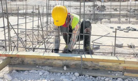  ?? CONTRIBUTE­D PHOTOS ?? One of over 60 Jamaicans currently employed on the Catherine Estates Housing Developmen­t Project. More than 90 per cent of all workers employed to CHEC Jamaica are Jamaicans.