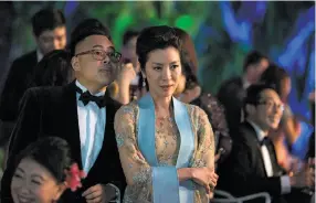  ??  ?? Oliver (Nico Santos, left) and Eleanor (Michelle Yeoh), the domineerin­g mother whose contempt for Rachel borders on bigotry.