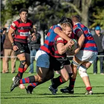  ?? PHOTO: DAVID WALKER/FAIRFAX NZ ?? Christchur­ch’s Dan Koster is wrapped up by Sydenham defence in Saturday’s top of the table clash.