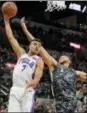  ?? DARREN ABATE — THE ASSOCIATED PRESS ?? The 76ers’ Timothe Luwawu-Cabarrot (7) grabs a rebound next to San Antonio Spurs’ Kyle Anderson during the first half of an NBA basketball game Friday in San Antonio.