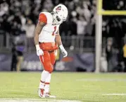  ?? Stew Milne / Associated Press ?? Greg Ward Jr. trudges off the field after throwing an intercepti­on to end UH’s final possession Saturday.