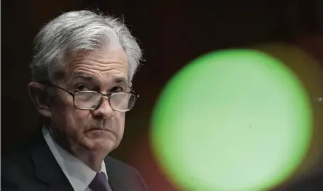  ?? GETTY IMAGES FILE PHOTOS ?? EASY HAND: Federal Reserve Chairman Jerome Powell says his agency, tasked with printing money among other jobs, will continue on its current course until the economy shows a significan­t rebound.