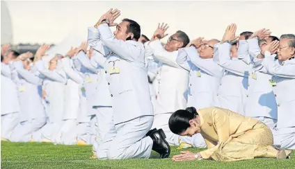  ?? PATIPAT JANTHONG ?? RIGHT Prime Minister Prayut Chan-o-cha and his wife, Naraporn, lead state officials in paying respect to King Bhumibol Adulyadej The Great at Sanam Luang.