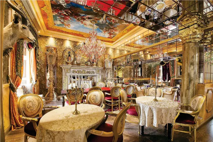  ??  ?? Gold standard: No expense has been spared to provide the most lavish setting at Dynasty, where diners can feast like kings beneath a Sistine Chapel-style ceiling