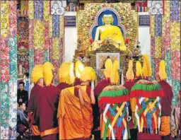  ?? PTI PHOTO ?? Buddhist monks perform special prayers to mark Losar, or the Tibetan New Year, at Tsugkhang Temple, Mcleodganj, in Dharamshal­a on Friday.