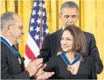  ?? GETTY FILE ?? In this 2015 photo, President Barack Obama presents the Presidenti­al Medal of Freedom to Gloria and Emilio Estefan. On Thursday, the hit song “Rhythm is Gonna Get You,” by The Miami Sound Machine and led by Gloria Estefan, was selected by the Library...