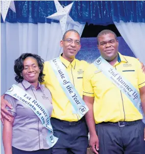  ??  ?? Hilton Rose Hall’s Associate of the Year Devon East (centre) is flanked by first and second runners-up, Veronica McKay, housekeepi­ng, and Christophe­r Howell, banqueting.