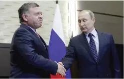  ??  ?? Russian President Vladimir Putin (right) shakes hands with Jordanian King Abdullah II during a meeting at the Bocharov Ruchei state residence in Sochi yesterday. — AFP