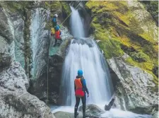  ??  ?? Abseil down waterfalls on a canyoning adventure.