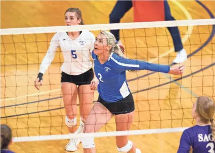  ?? PHOTOS BY DOUG HOKE/THE OKLAHOMAN ?? Lacy Beeler (2) has done whatever it takes to play her senior volleyball season at OCU, including going from a nursing shift straight to practice.