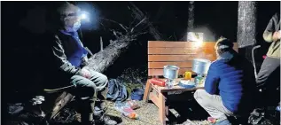  ??  ?? Hot chocolate anyone? David Hutt, Scouter with the 36th Halifax Scout Troop, looks on as one of the scouts prepares a warm drink on a fresh fall night.