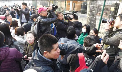  ?? AFP photo ?? Journalist­s take photos outside the North Korean embassy in Beijing. Journalist­s gathered at the embassy after being invited to a press conference about Ri Jong-Chol, a North Korean suspect in the murder of the half-brother of the country’s leader. The...