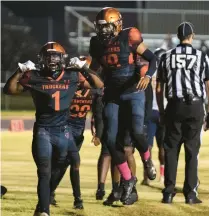  ?? ?? Churchland running back Dontavius Booker, center, celebrates after scoring a two-point conversion to put his team up by seven.