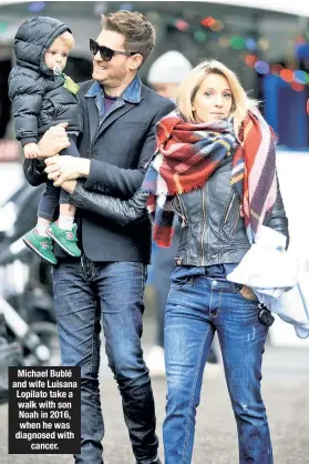  ??  ?? Michael Bublé and wife Luisana Lopilato take a walk with son Noah in 2016, when he was diagnosed with cancer.