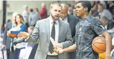  ?? DAVID SILVERMAN VIA BRYANT UNVIERSITY ATHLETICS ?? Bryant assistant Chris Burns, left, is the only openly gay assistant or head coach in Division I men’s and women’s basketball.