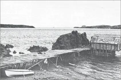  ??  ?? A fishing interest at Twillingat­e. This photo from “Newfoundla­nd and Labrador Provincial Parks” is credited to Harold Burgess. Note the door at the end of the shed positioned over water sufficient­ly deep for a laden open boat to come by and off-load...