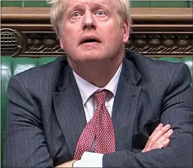  ??  ?? STRAIN: A glum Boris Johnson during a Commons debate two weeks ago