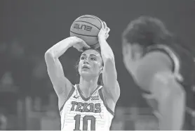  ?? AARON E. MARTINEZ/AMERICAN-STATESMAN ?? Guard Shay Holle, a former Westlake standout, has shot 50% to help Texas to a 27-4 record this season. She was the American-Statesman’s 2020 Central Texas player of the year.