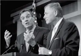  ?? ASSOCIATED PRESS ?? SENATE INTELLIGEN­CE COMMITTEE CHAIRMAN Sen. Richard Burr, R-N.C., listens at right as the committee’s Vice Chairman Sen. Mark Warner, D-Va. speaks during a news conference on Capitol Hill in Washington on Wednesday to discuss the committee’s...