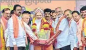  ??  ?? PM Narendra Modi being felicitate­d by BJP workers during a public rally in Bengaluru on Thursday. PTI PHOTO