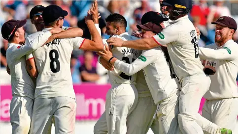  ?? REX/SHUTTERSTO­CK ?? Level best: Keshav Maharaj (centre) is mobbed after his seventh wicket of the innings sealed a tie