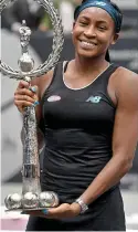  ?? GETTY IMAGES ?? First of many: Coco Gauff lifts the Linz trophy