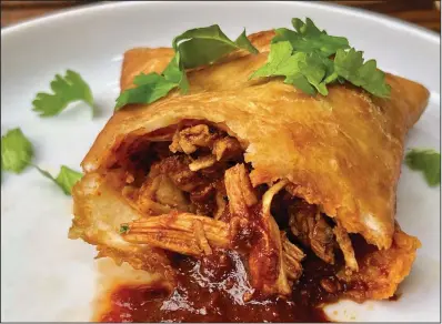  ??  ?? Sopaipilla­s stuffed with Pulled Chicken in Red Chile Sauce