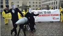  ?? Picture: AP/African News Agency (ANA) ?? END OF ARMS: Activists of the Internatio­nal Campaign to Abolish Nuclear Weapons protest against the conflict between North Korea and the US with masks of North Korean ruler Kim Jong-Un (right) and US President Donald Trump (left) in front of the US embassy in Berlin, Germany, last year.