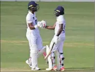  ?? (AFP) ?? Sri Lanka’s Niroshan Dickwella (R) celebrates after scoring a half-century (50 runs) with his teammate Dinesh Chandimal on the final day of the first Test against Bangladesh at the Zahur Ahmed Chowdhury Stadium in Chittagong on Thursday.