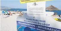  ?? Picture / AP ?? A bylaw posted on at a beach in Villeneuve­Loubet in southern France lets the public know women are not allowed to wear a burkini.