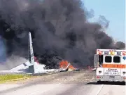  ?? JAMES LAVINE/ASSOCIATED PRESS ?? Flames and smoke rise Wednesday from an Air National Guard C-130 cargo plane that crashed in Georgia.