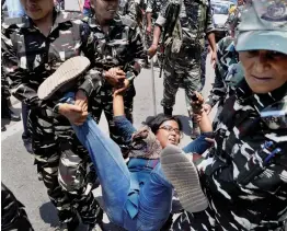  ?? — PTI ?? CPI(M) members being taken away by the security personnel during a protest in Guwahati on Tuesday against hike in price of essential commoditie­s.