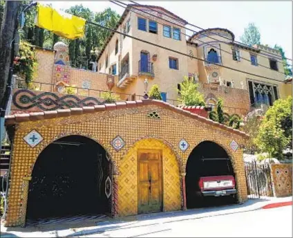  ?? Photograph­s from Los Angeles Department of City Planning ?? THIS 1927 Spanish Colonial Revival home in Studio City is richly covered in folk art and tile.