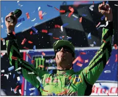  ?? AP/The Daily Press/JAMES QUIGG ?? Kyle Busch celebrates after winning the NASCAR Monster Energy Cup Series race Sunday at Auto Club Speedway in Fontana, Calif. It was Busch’s 200th career victory across the Cup, Xfinity and Truck series.