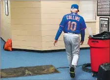  ?? DERIK HAMILTON/AP PHOTO ?? Mets manager Terry Collins walks from his office after resigning following Sunday’s 11-0 loss to the Phillies at Philadelph­ia.