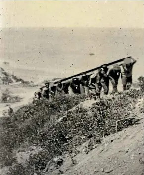  ?? ALEXANDER TURNBULL LIBRARY REF: PA1-O-026-42-3 ?? Ma¯ori soldiers carry iron girders up a hill at Gallipoli circa 1915.