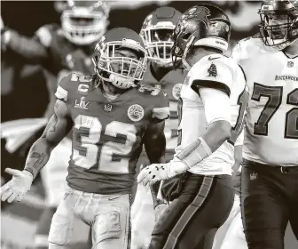  ?? Travis Heying / Tribune News Service ?? Kansas City safety Tyrann Mathieu, left, got caught up in a heated exchange with Tampa Bay quarterbac­k Tom Brady at midfield during the second quarter of Super Bowl LV on Sunday night.