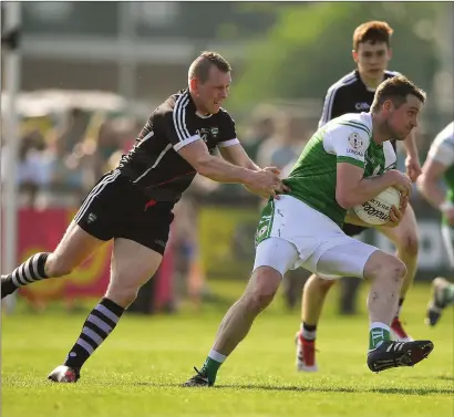  ??  ?? Anthony McDermott of London, centre, in action against Sligo’s Adrian Marren during the Connacht quarter-final.