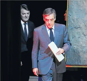  ?? /Reuters ?? Growing allegation­s: Francois Fillon, right, former French prime minister and 2017 presidenti­al election candidate, is followed by Francois Baroin, president of the Associatio­n of the Mayors of France as they arrive at the associatio­n’s conference in...