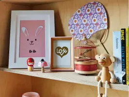  ?? ?? Birch-plywood shelves made by carpenter Wayne Perrey (@thetvcarpe­nter) house all of Bo’s knick-knacks, from books to baskets, plus a personalis­ed bunny print and framed postcard