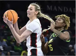  ?? DAVID BECKER — THE ASSOCIATED PRESS ?? Stanford forward Cameron Brink, left, grabs a rebound next to Oregon center Phillipina Kyei during the second half of a game in the quarterfin­als of the Pac-12women's tournament on Thursday in Las Vegas.